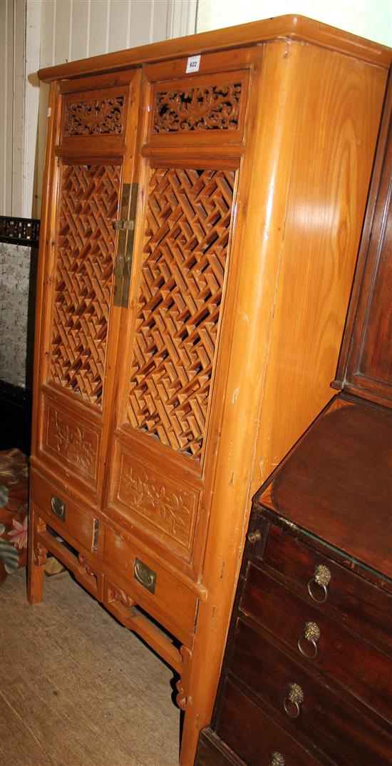 Chinese hardwood cupboard with fretwork doors(-)